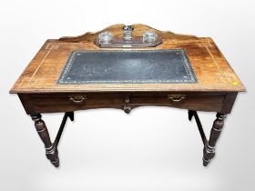 A Victorian mahogany and parquetry inlaid leather topped writing desk,