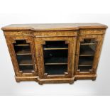 A Victorian figured walnut and satinwood inlaid breakfront credenza,