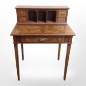 A reproduction yewwood lady's writing table,