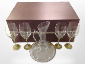 A set of four contemporary crystal and enamelled metal wine glasses with matching ewer,