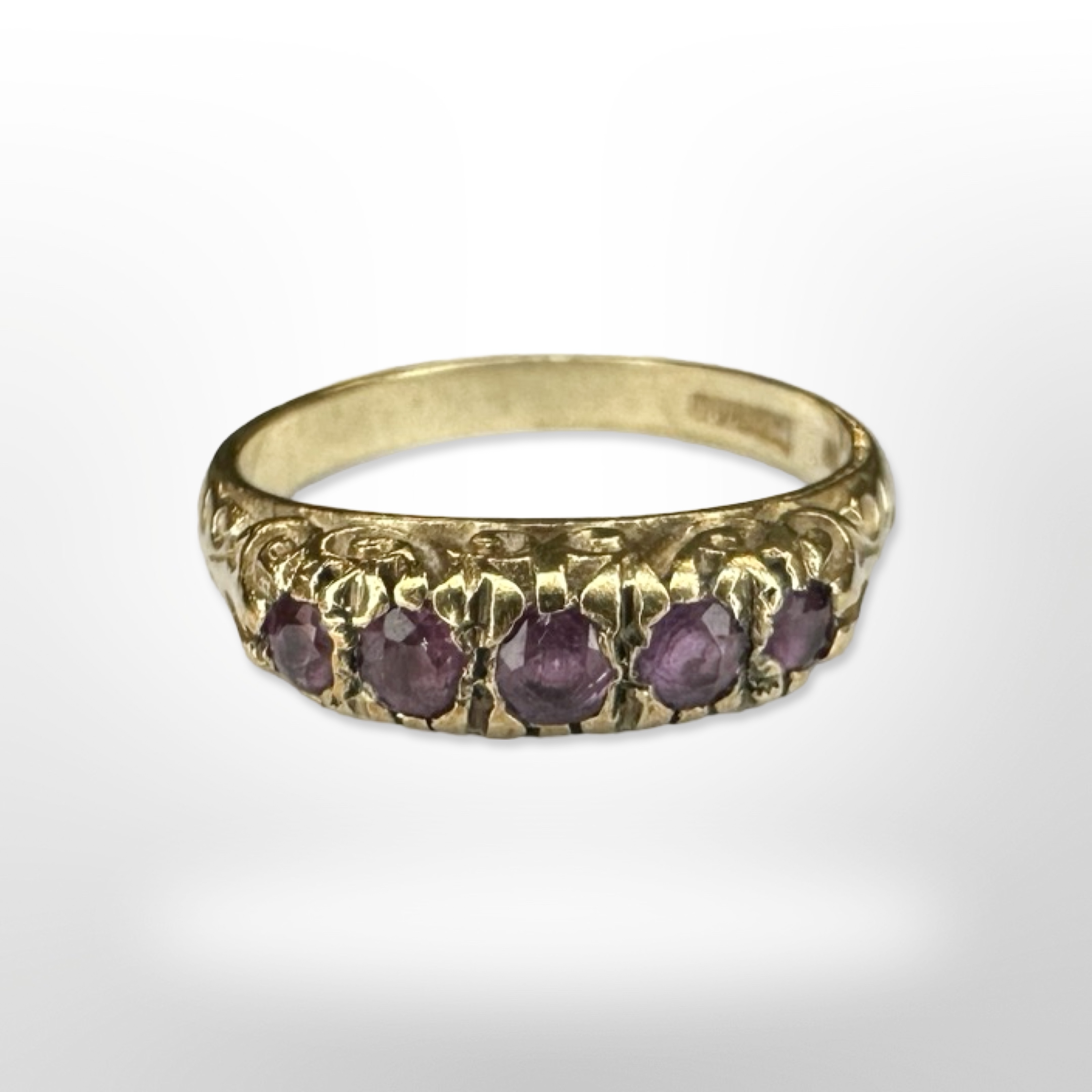 A 9ct yellow gold five stone ruby ring, size L. CONDITION REPORT: 2.9g.