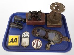 A vintage AA badge, flying goggles, two pairs of binoculars,
