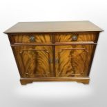 A reproduction mahogany side cabinet,