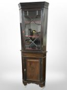 A mahogany 19th century standing corner cabinet,