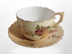 A Royal Worcester blush ivory teacup and saucer.