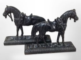 A pair of cast iron horse door stops,