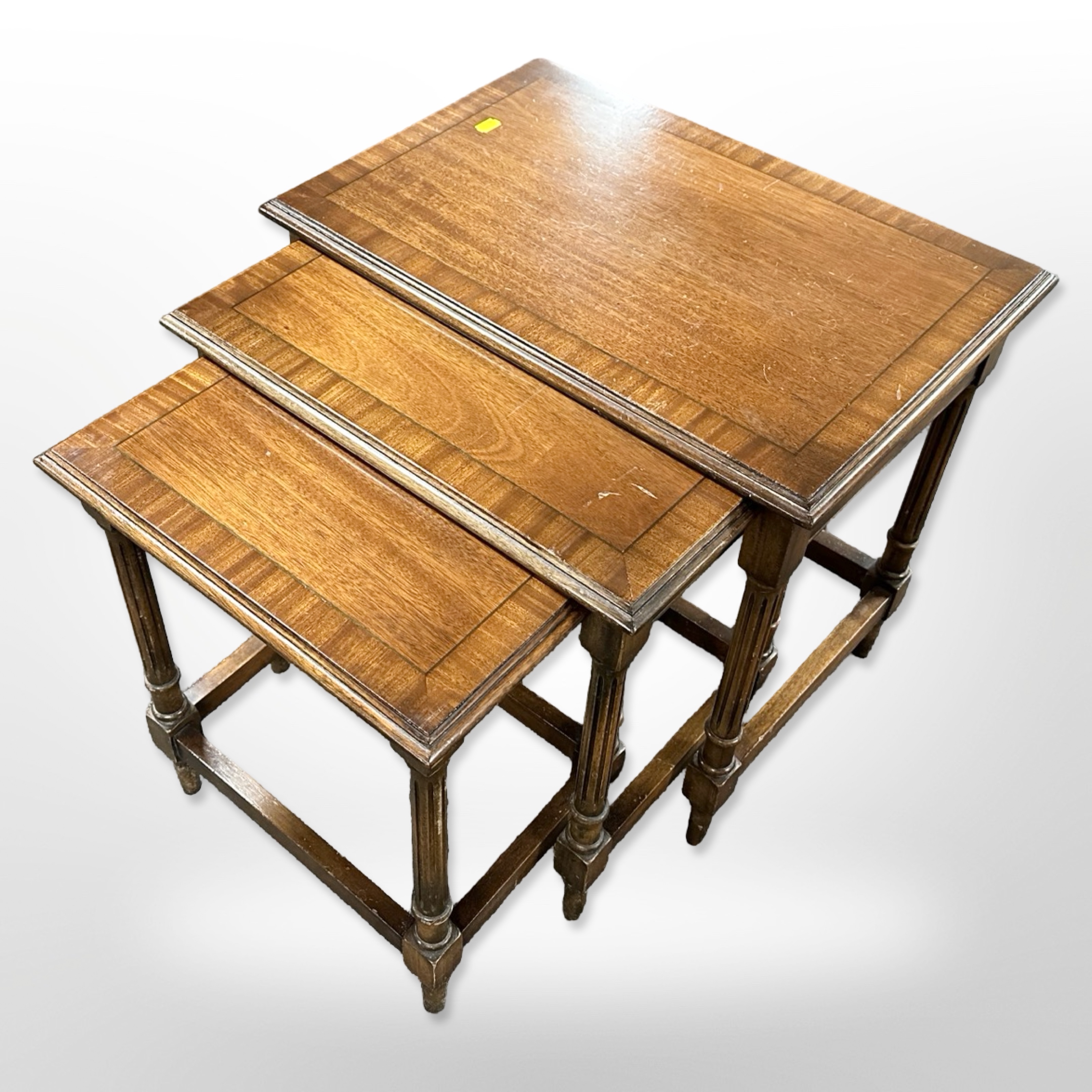 A reproduction nest of three inlaid mahogany tables,