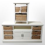 A Cotswold Furniture Company white painted low chest fitted with wicker drawers and cupboards,