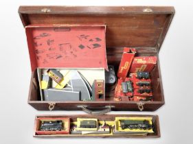 An antique joiner's tool box containing Hornby railway items, to include 00 gauge locomotives,