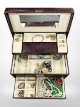 A jewellery box containing costume jewellery,