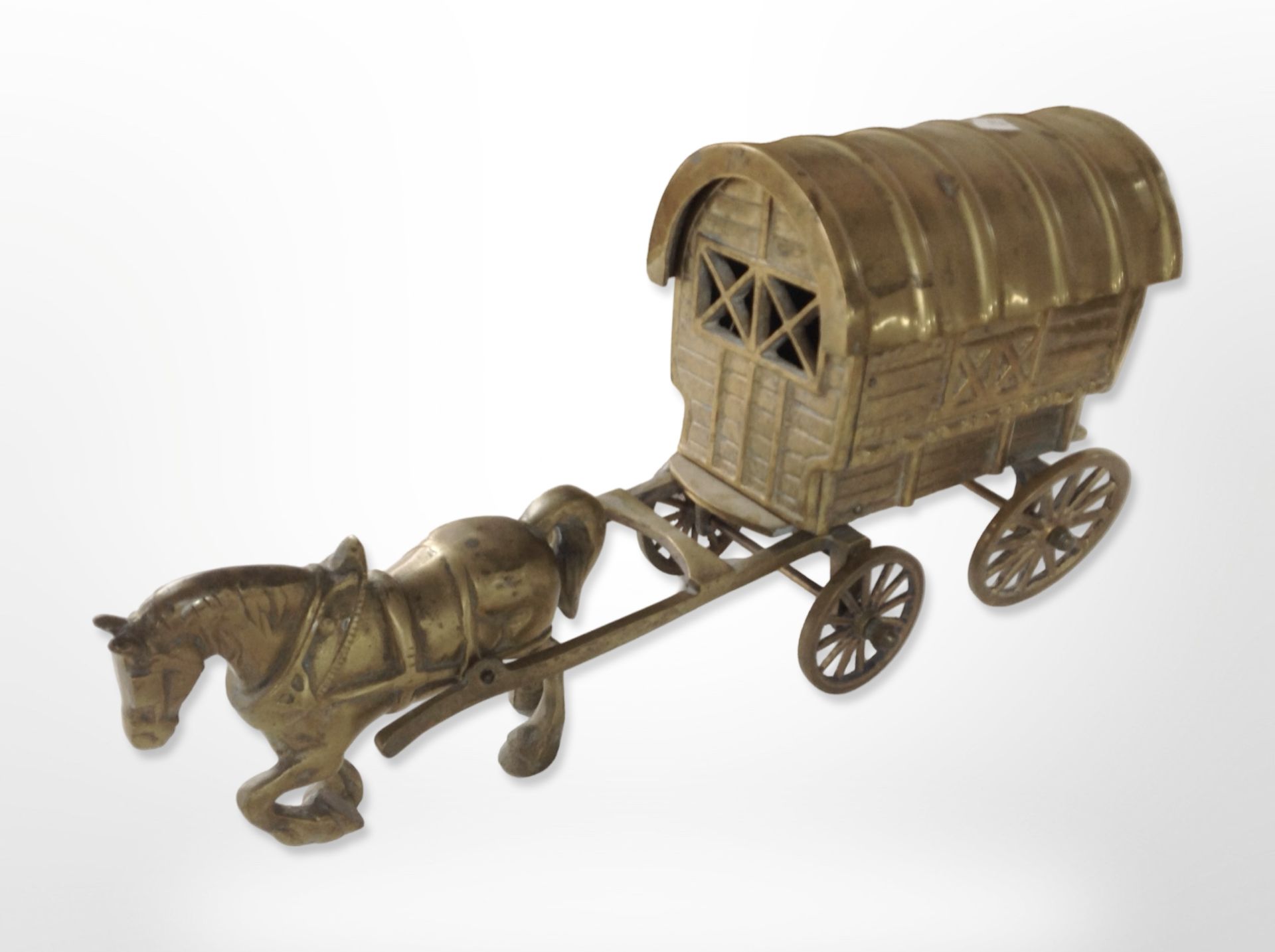 A cast-brass figure of a horse and caravan, length 53cm.