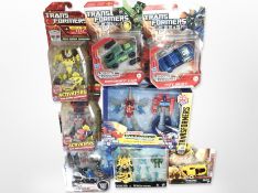 Eight Hasbro Transformers figurines, boxed.