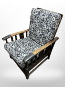 An early 20th century oak and studded leather armchair width 65 cm