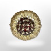 A 9ct yellow gold garnet cluster ring, size N. CONDITION REPORT: 5.6g.