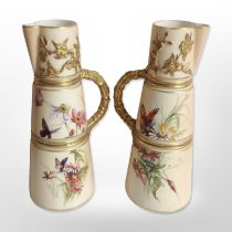 A pair of Royal Worcester blush ivory tapered jugs, shape number 1047, height 20cm.