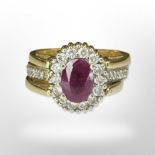 A yellow gold ruby, sapphire and diamond cluster revolving ring, size L/M.