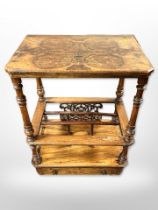 A Victorian figured walnut and satinwood inlaid book table fitted a drawer,