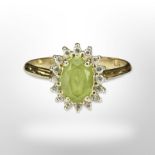 A 14ct yellow gold peridot diamond cluster ring, size N/O. CONDITION REPORT: 2.