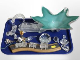 A group of crystal paperweights including Swarovski pieces, studio glass bowl,