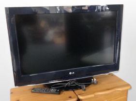 An LG 32-inch LCD TV with lead and remote.