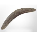 A carved boomerang,