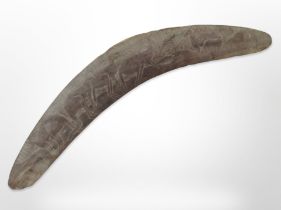 A carved boomerang,