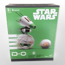 A Hasbro Disney Star Wars D-O interactive Bluetooth droid, in box.