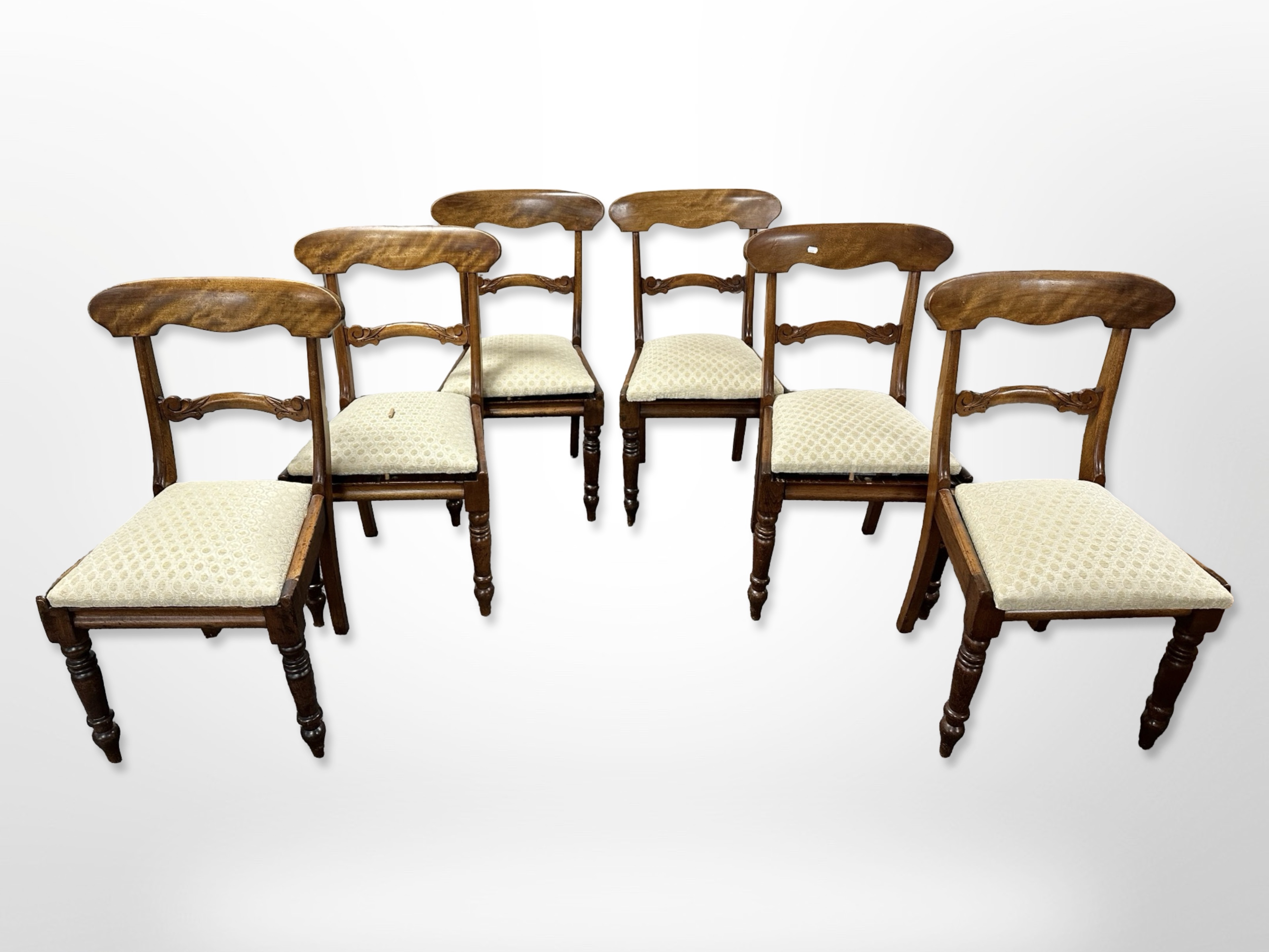 A set of four mahogany reproduction dining chairs