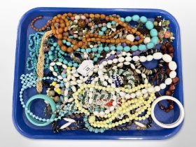 A group of costume jewellery, beaded necklaces,