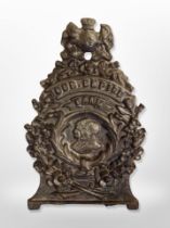 A reproduction cast iron money box,