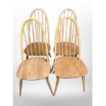 A set of four Ercol light elm and beech spindle backed dining chairs