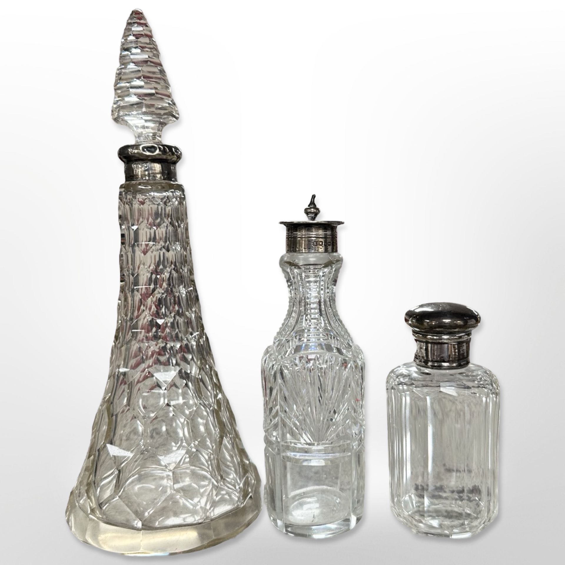 Three silver mounted scent bottles,