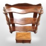 A small mahogany three tier wall shelf,