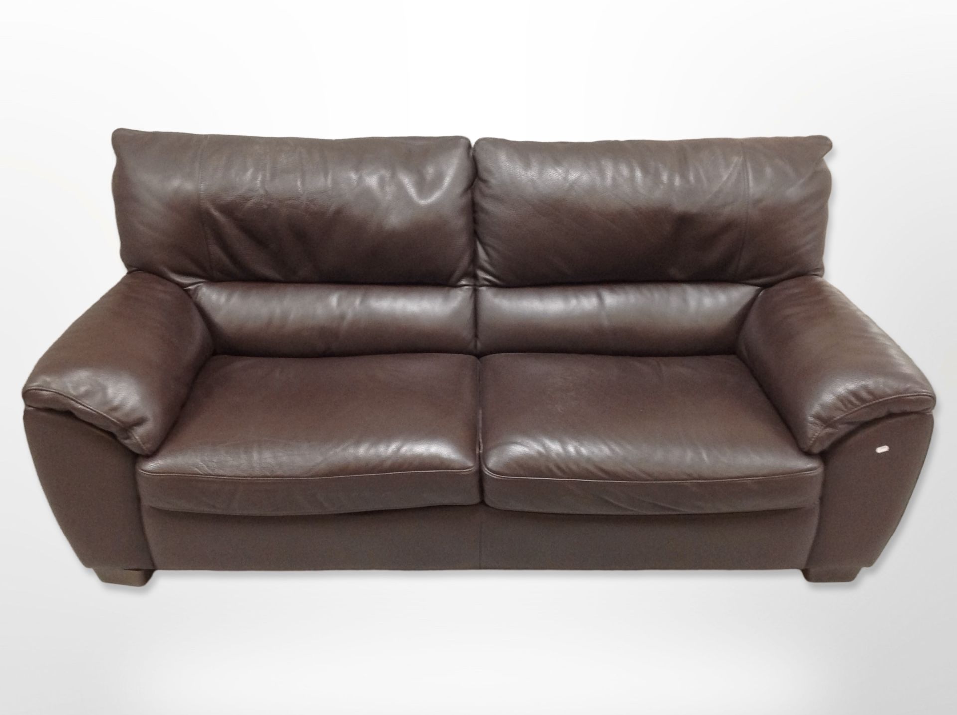 A contemporary stitched leather three seater settee,