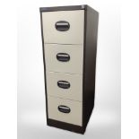 A four drawer office filing cabinet,