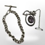 An antique silver brooch with amethyst swing drop pendant together with a silver watch chain with