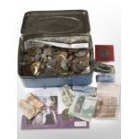 A tin of mixed British coins, crowns, foreign bank notes, etc.