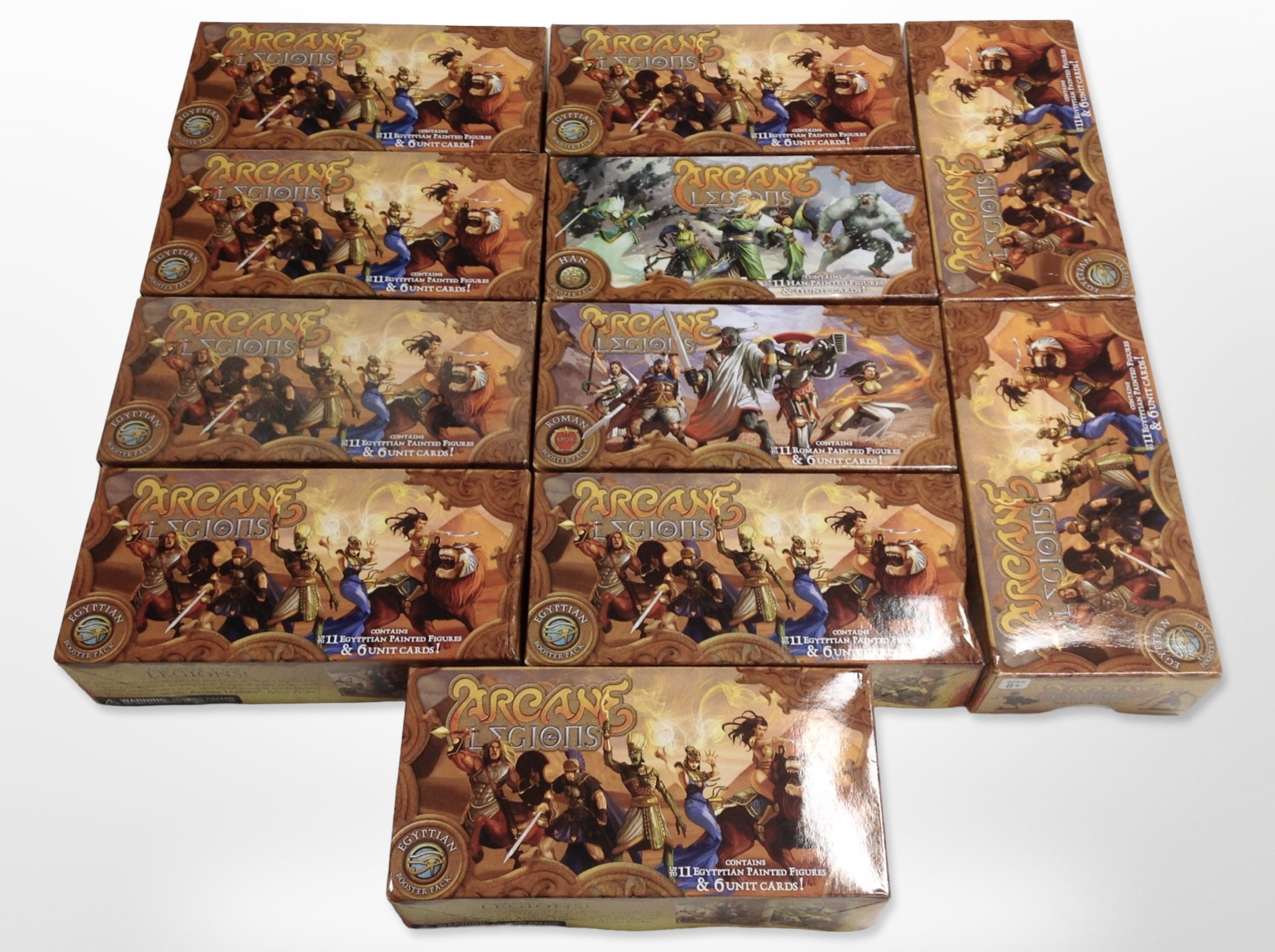 11 Arcane Legions miniatures booster packs containing figures and cards, all Egyptians.