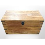A mango wood blanket chest with metal mounts,