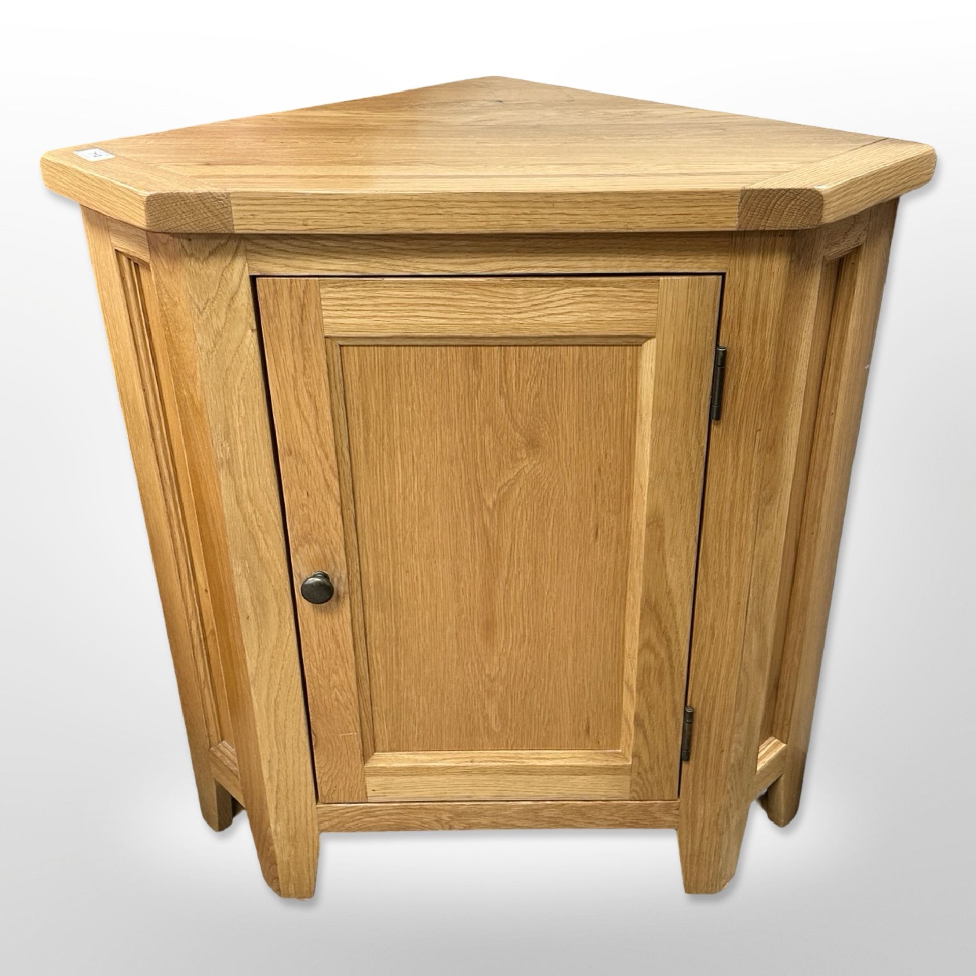 A contemporary oak corner cabinet, 75cm wide x 79cm high x 50cm deep.