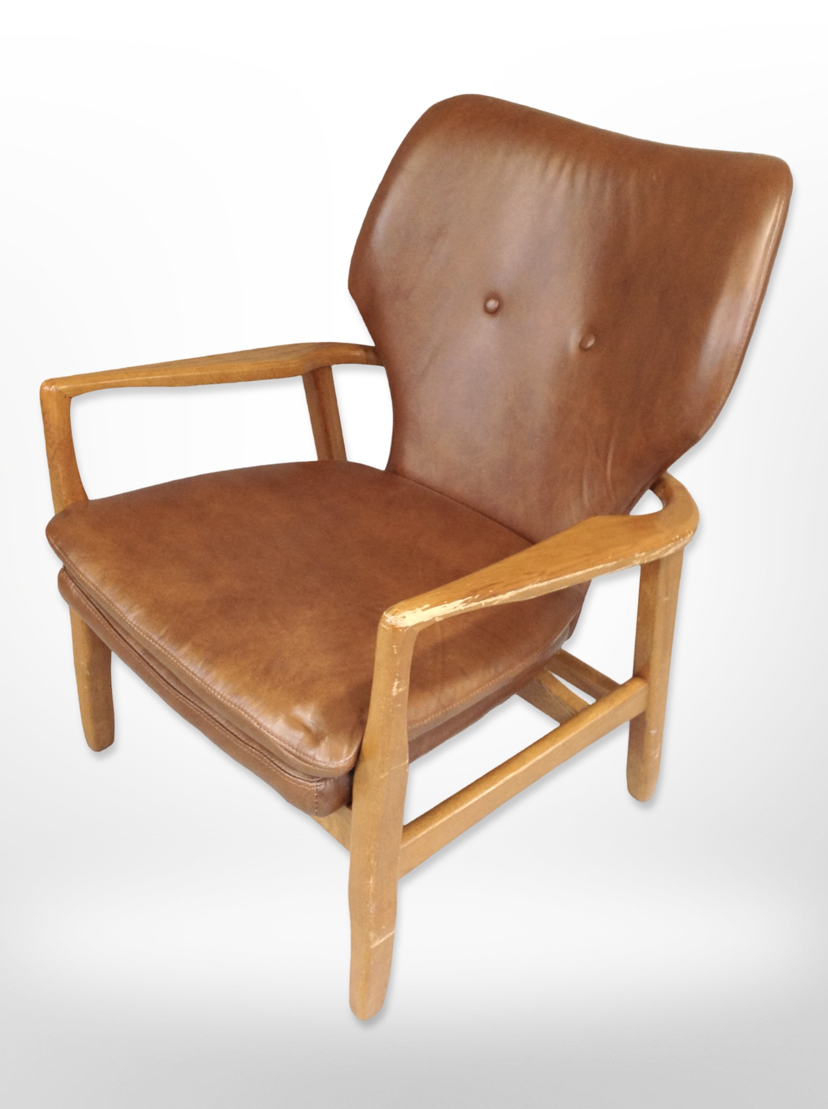 A contemporary Scandinavian oak framed armchair with stitched vinyl upholstery