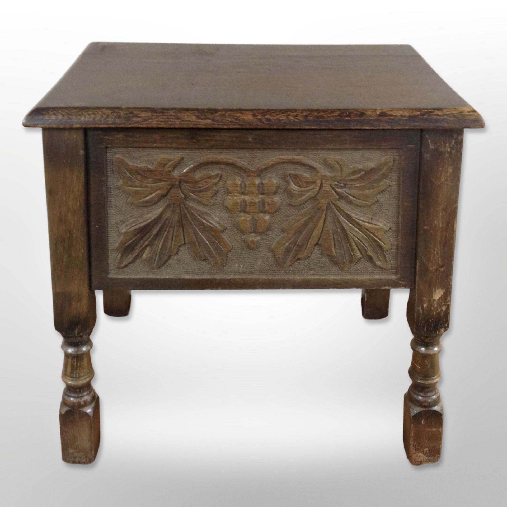 A carved oak work box,