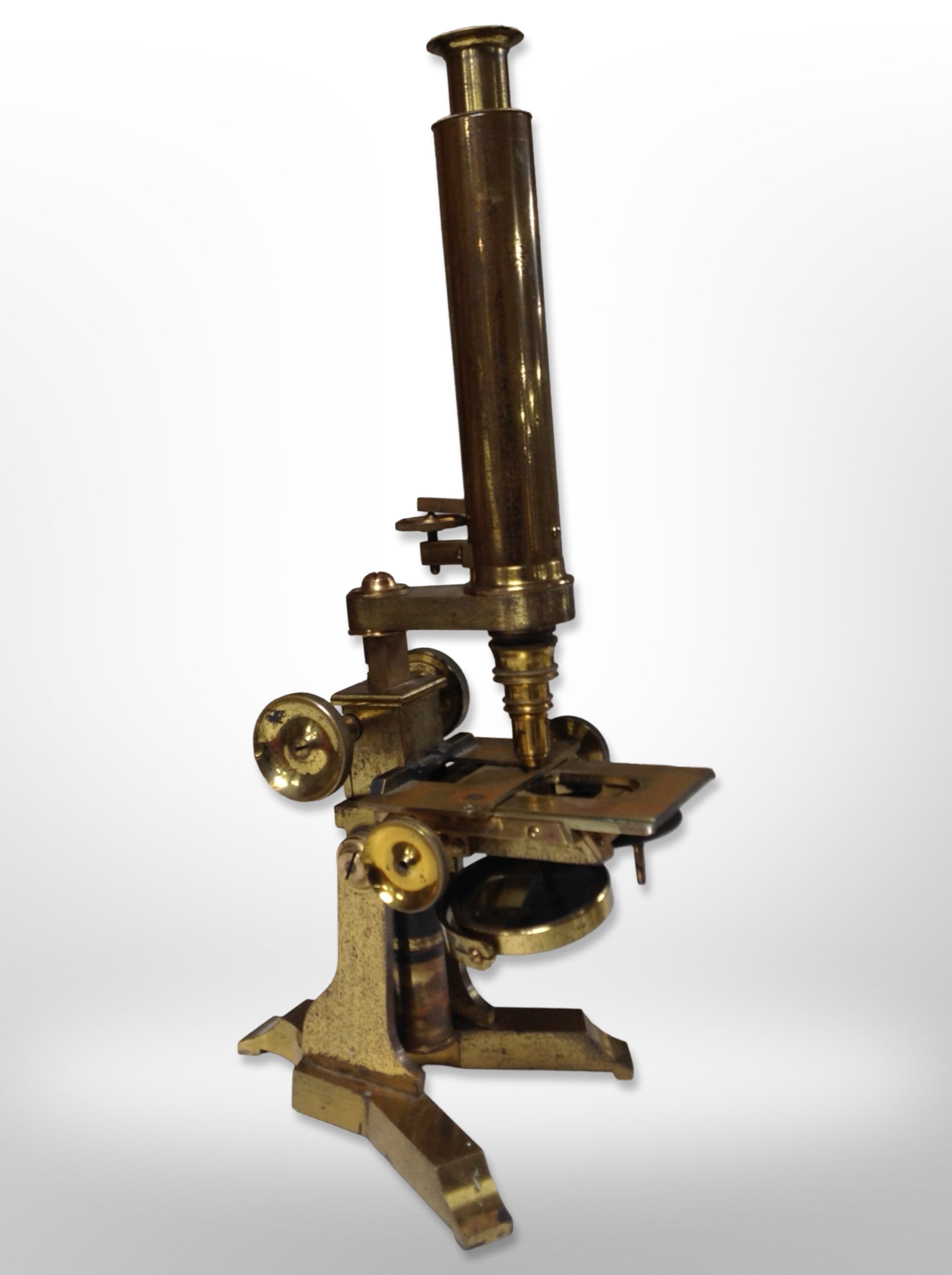 An early 20th century lacquered brass microscope by J.