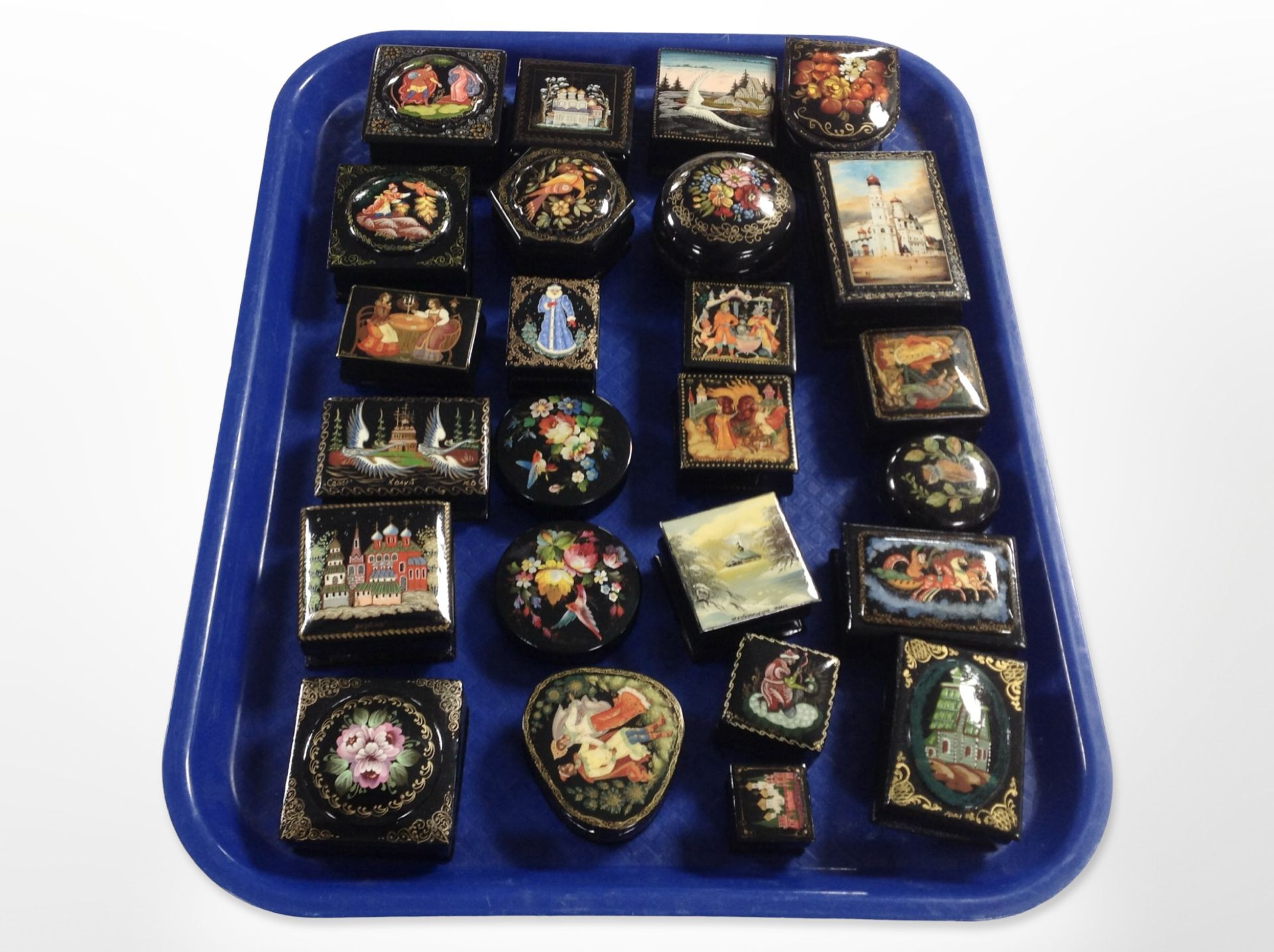 A collection of Russian lacquered trinket boxes.