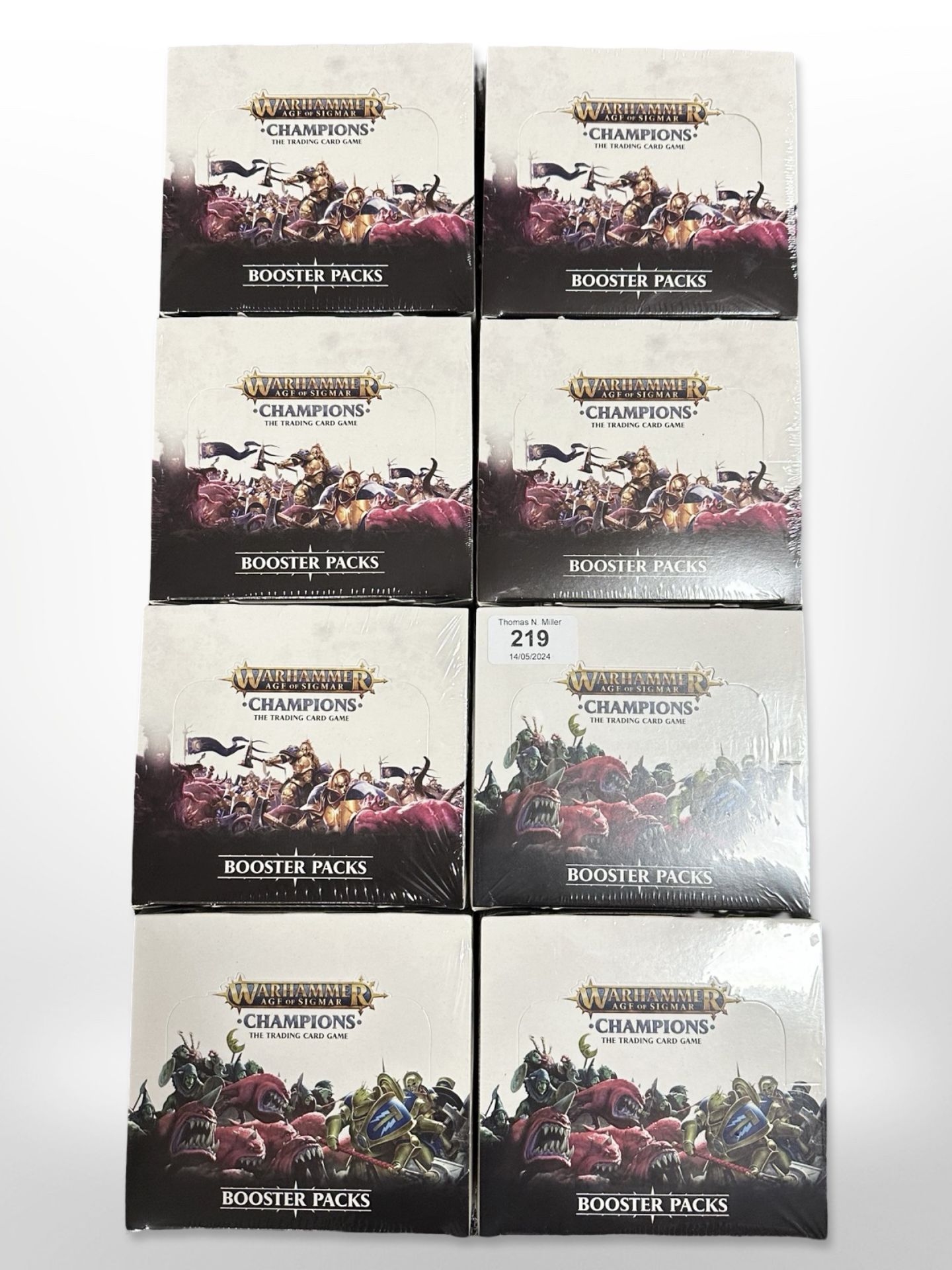 Eight Warhammer Age of Sigmar Champions Trading Card Game booster sets, all sealed in cellophane.