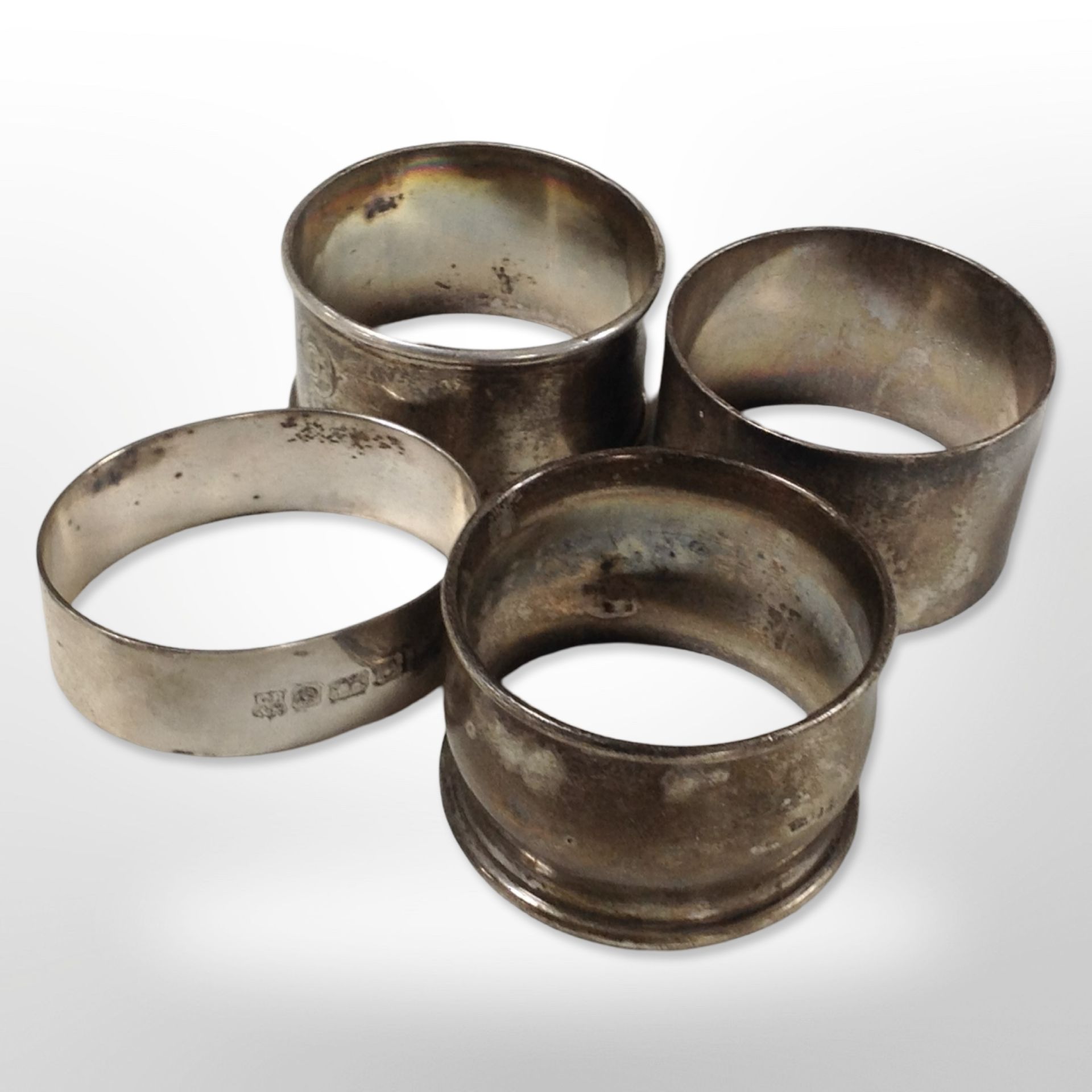 Four silver napkin rings. CONDITION REPORT: 84.8g gross.
