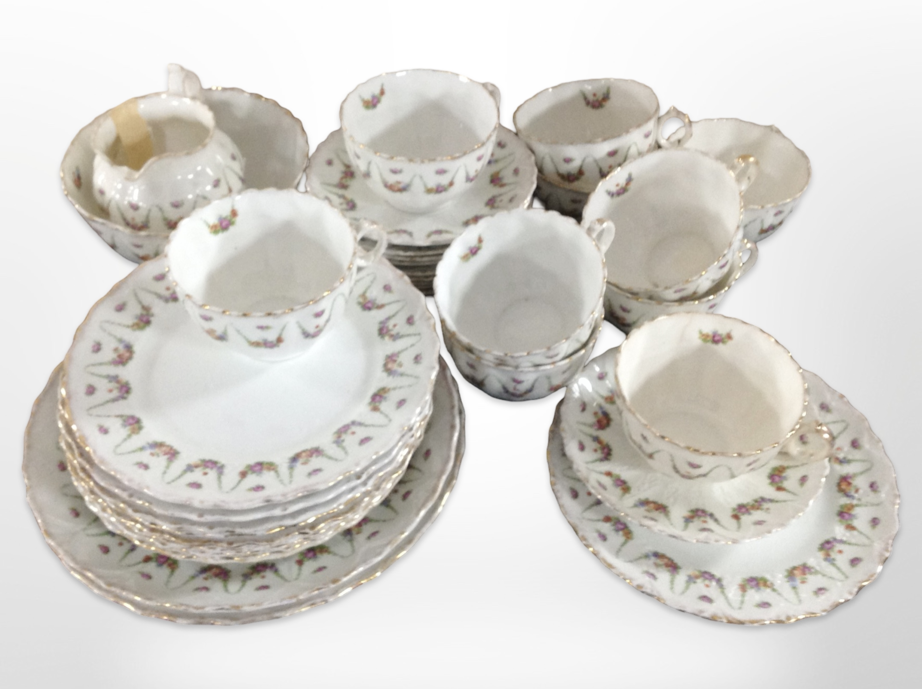 Approximately thirty six pieces of early 20th century English tea china decorated with floral