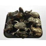 A group of cast-bronze frog ornaments,