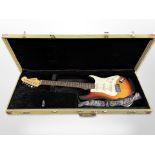 A Squire by Fender electric strat guitar, in fitted Rockcase,