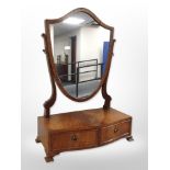A 20th century mahogany shield-shaped dressing table mirror,